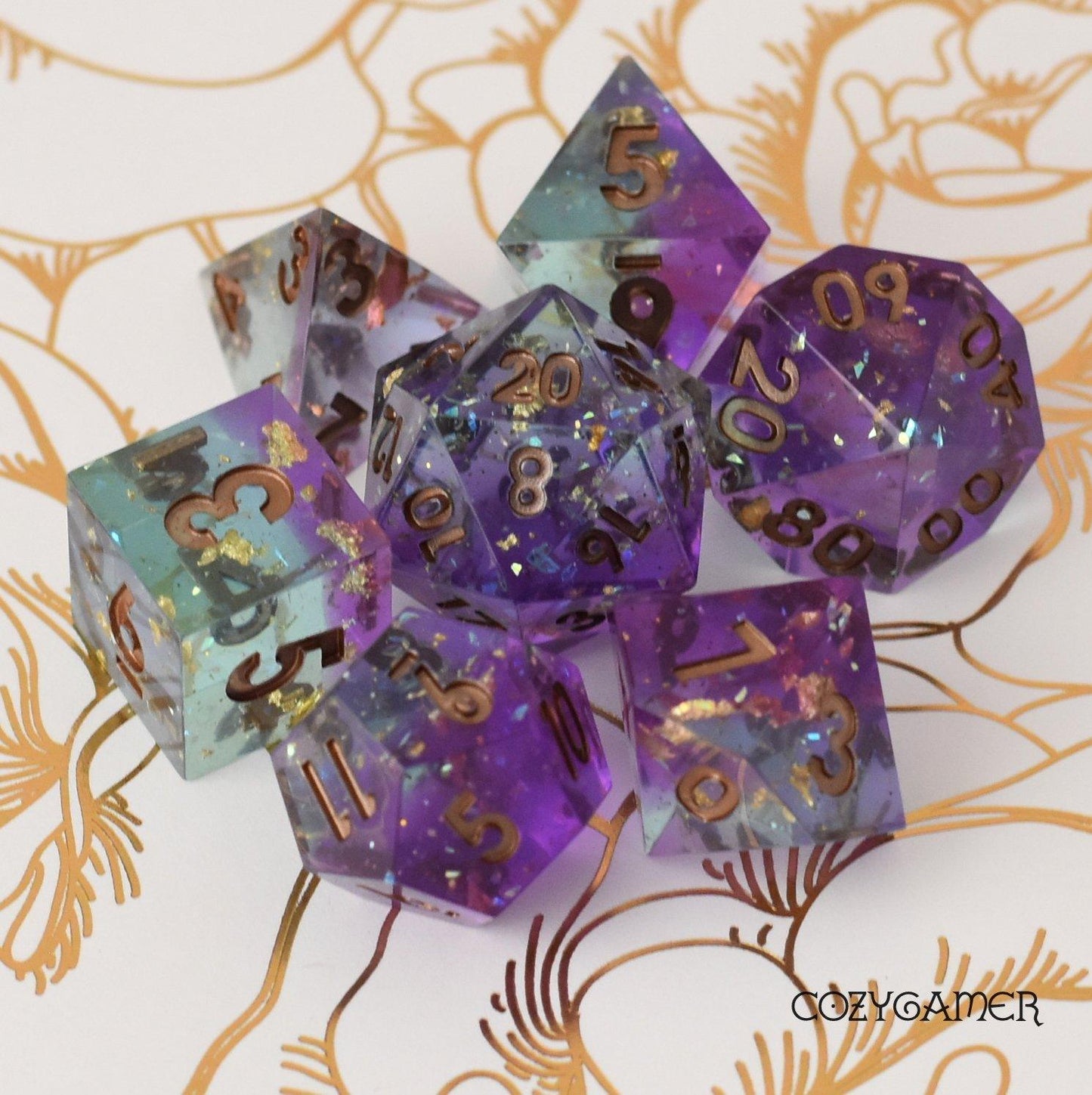 Enchanter's Tower Sharp Edge Dice Set. Layered Purple and Blue Clear resin with copper foil and opal flakes