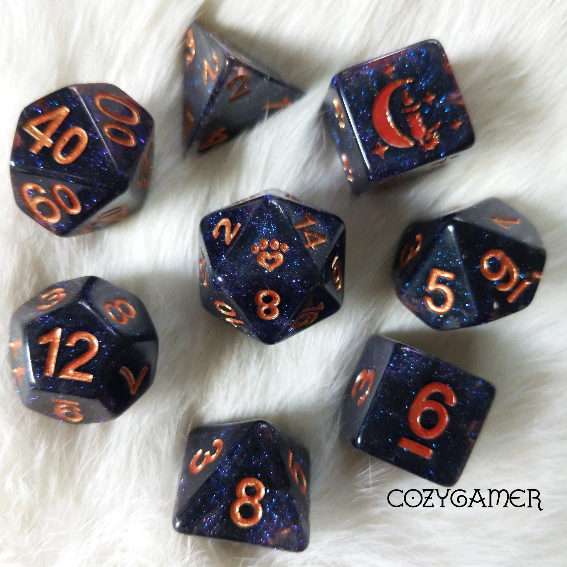 Endless Expanse 8 Piece Dice Set. Clear resin with pearly black clouds, glitter, and copper font.