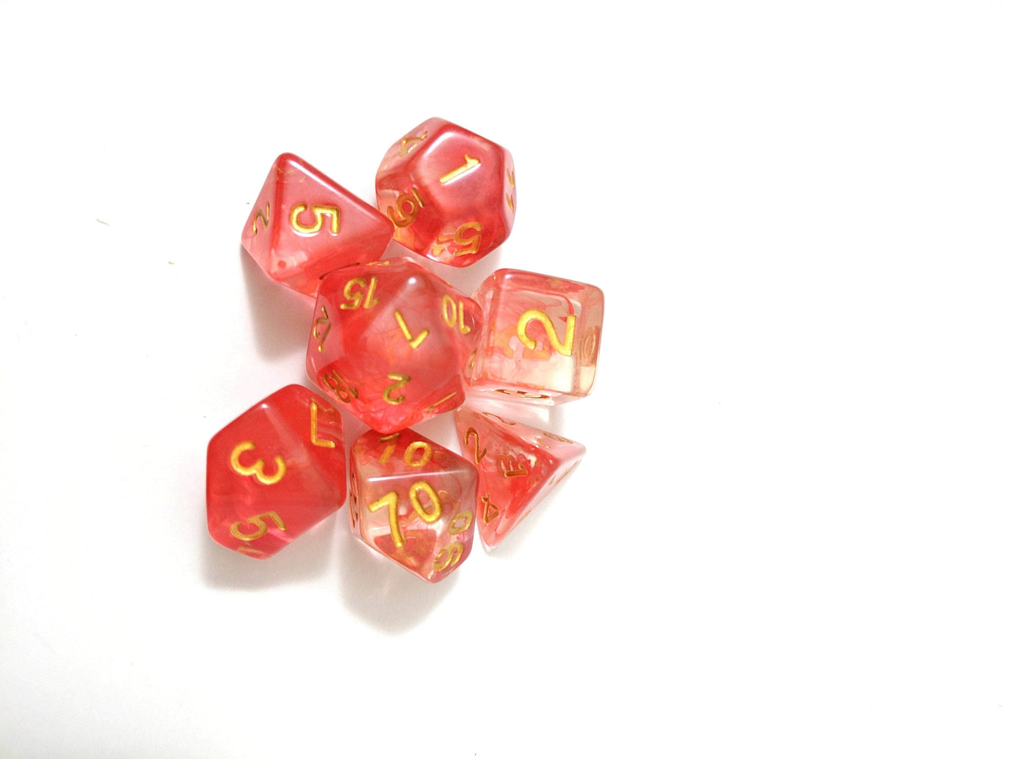 Fire Flick 7 piece red DnD dice set with clear design and suspended red ink, perfect for TTRPG campaigns and collections.