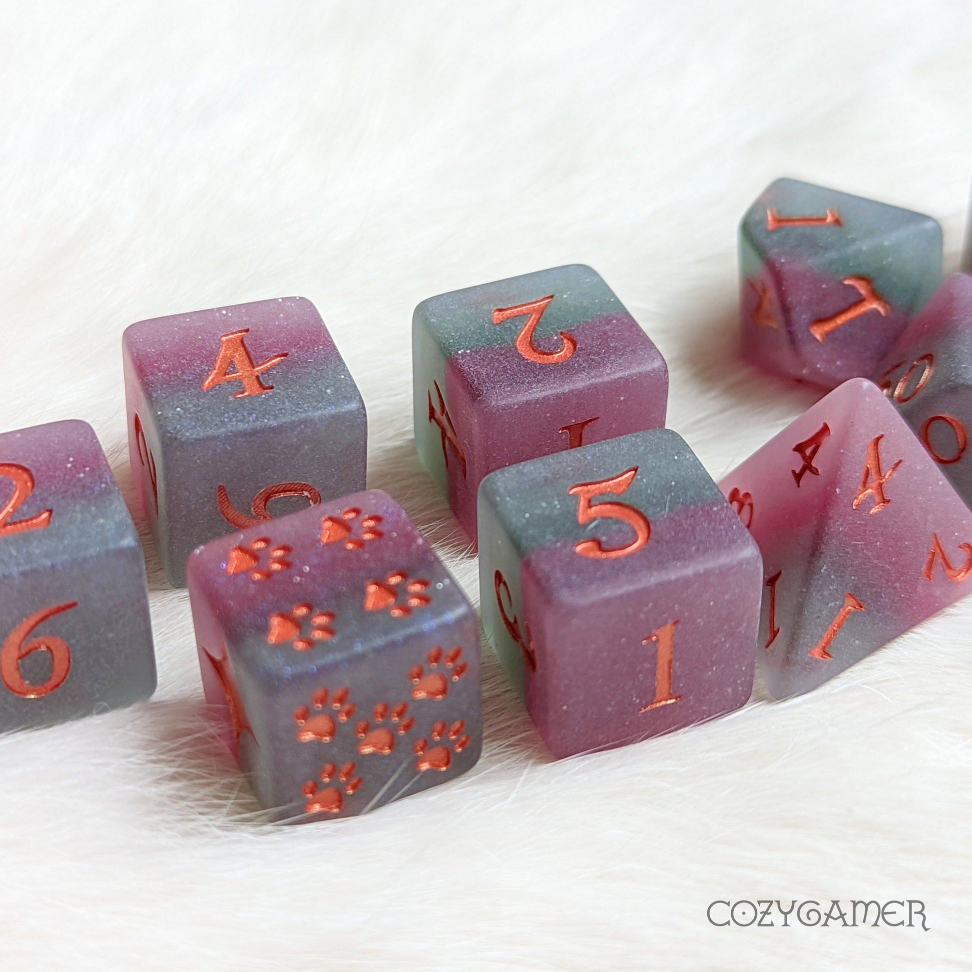 Fluorite purple and green layered resin DnD dice set with custom font, featuring D6 and D10 dice for role-playing games.