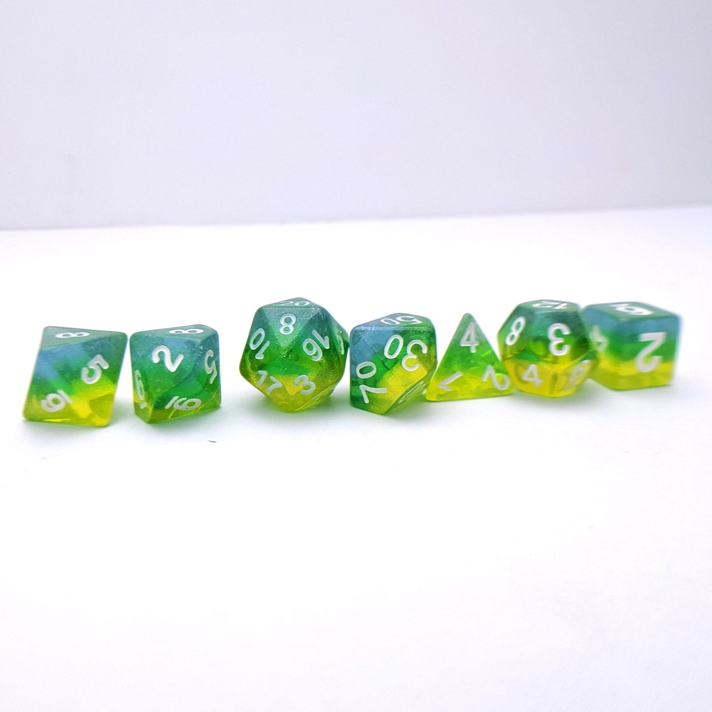 Genesis DnD Dice Set, Blue, green, and yellow Layer Glitter Dice - CozyGamer