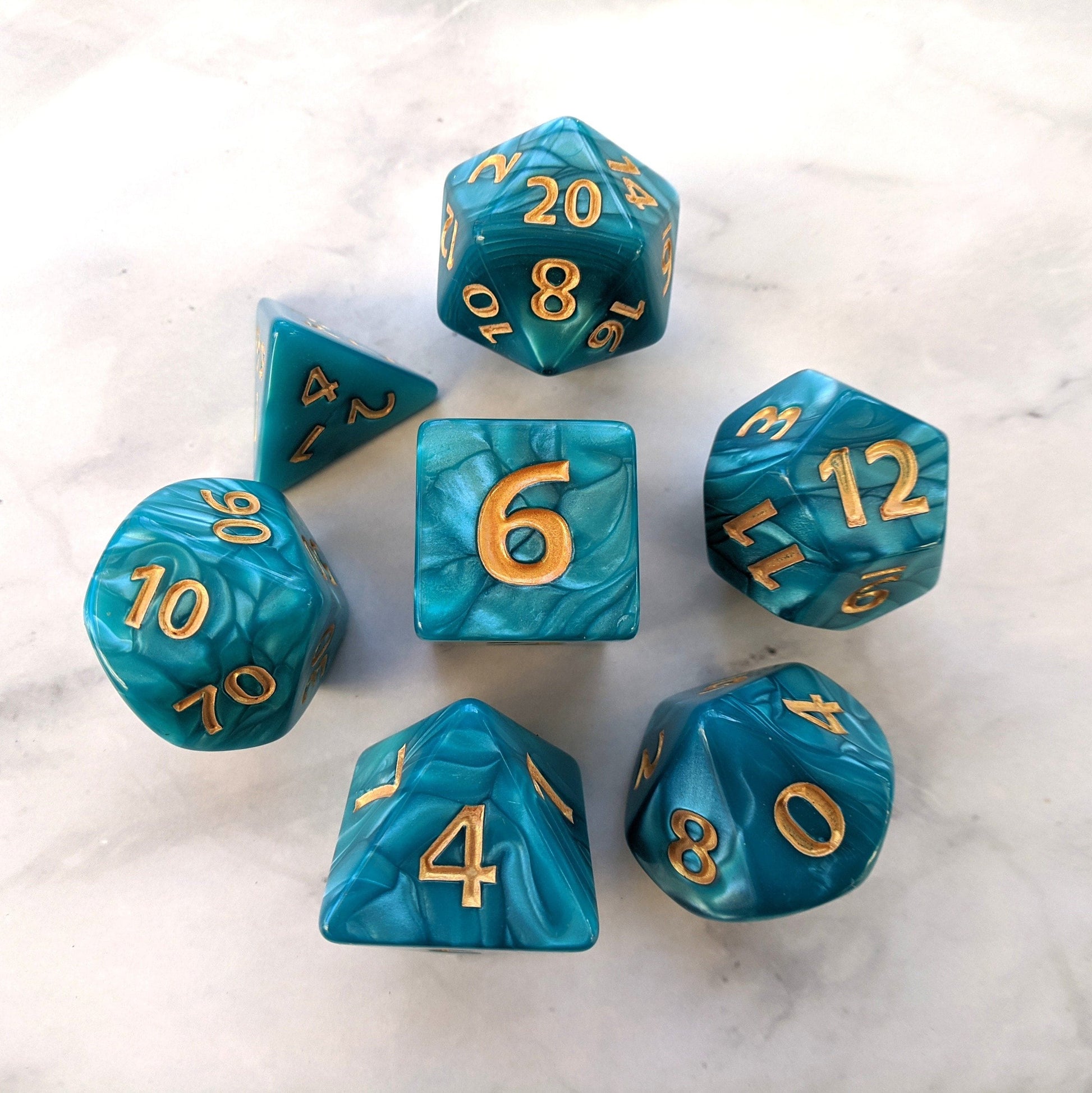 Giant Aquatic Dice Set in pearly blue marble, featuring large 7-piece polyhedral dice for tabletop games like Dungeons and Dragons.