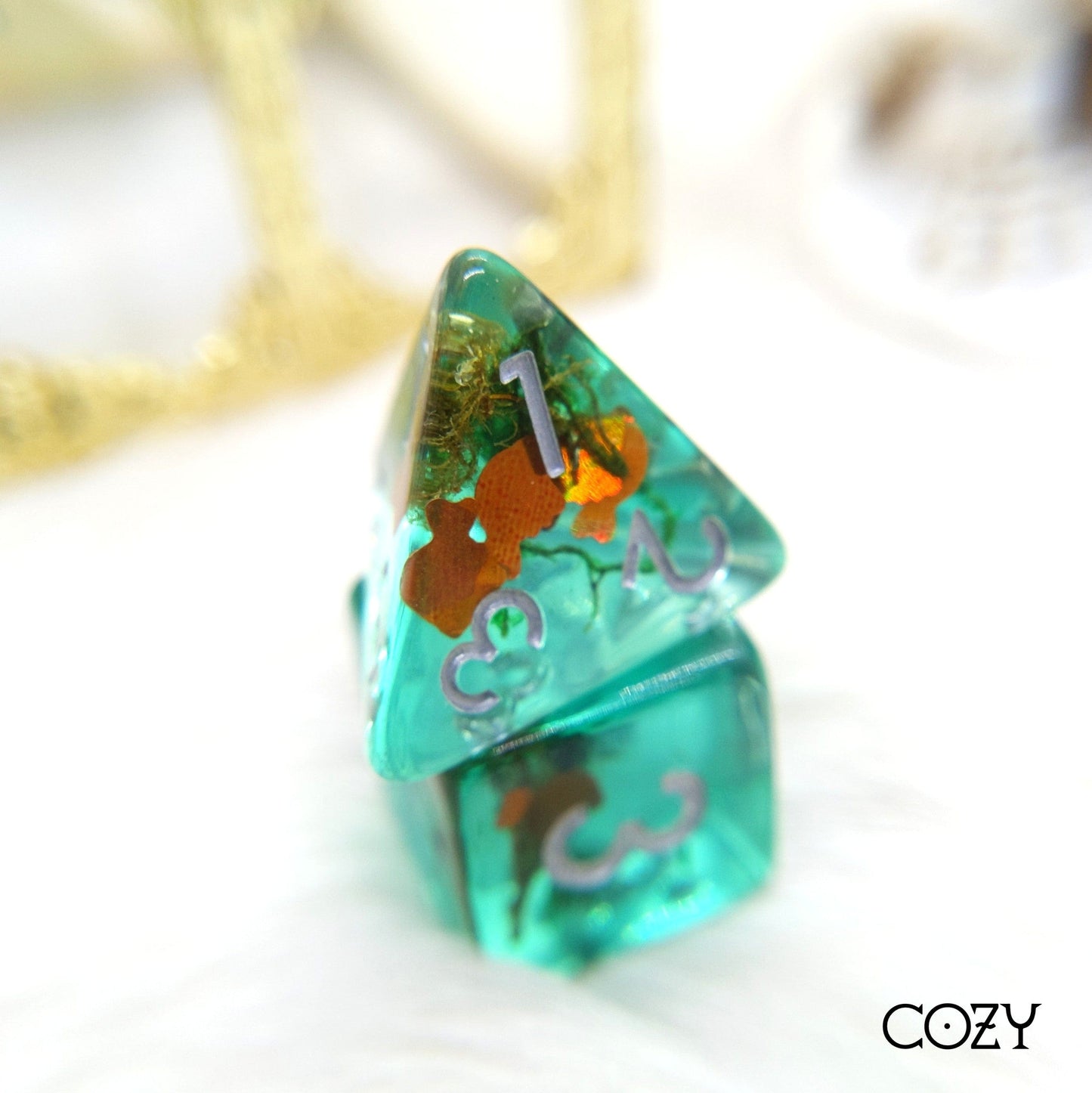 Goldfish Pond. Teal resin dice set with gold fish and plants