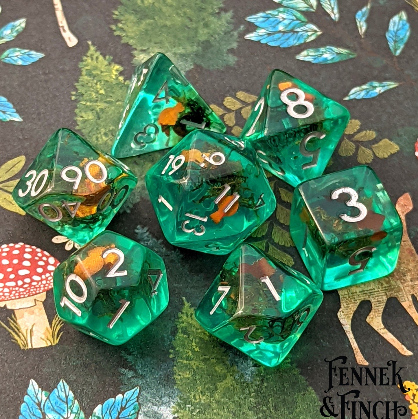 Goldfish Pond. Teal resin dice set with gold fish and plants