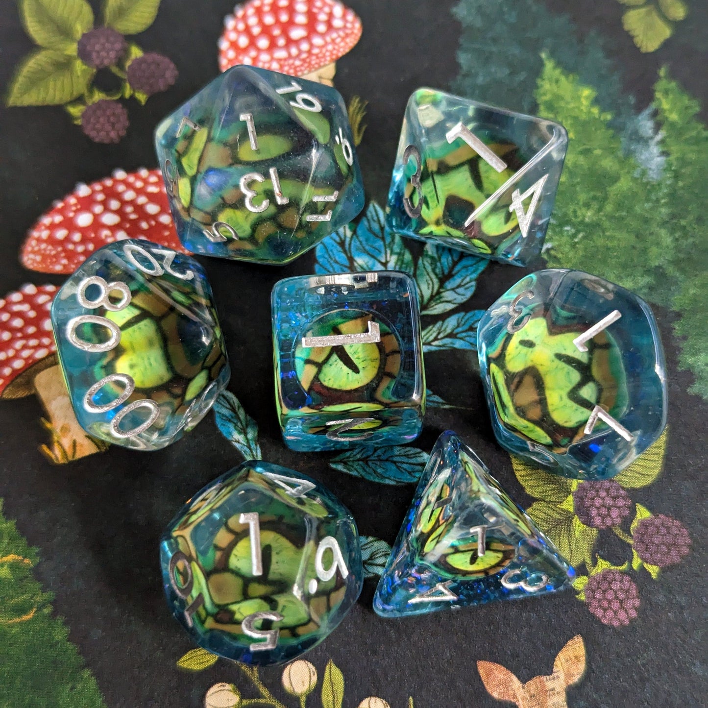 Green Eye DnD Dice Set with detailed eye design on blue background, perfect for tabletop games like Dungeons and Dragons.