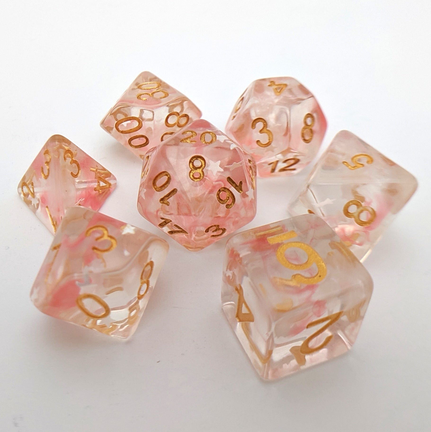 Harvest Moon Dice Set – 7-Piece Translucent Coral White Stars Gold Font DnD Dice sets Fennek and Finch