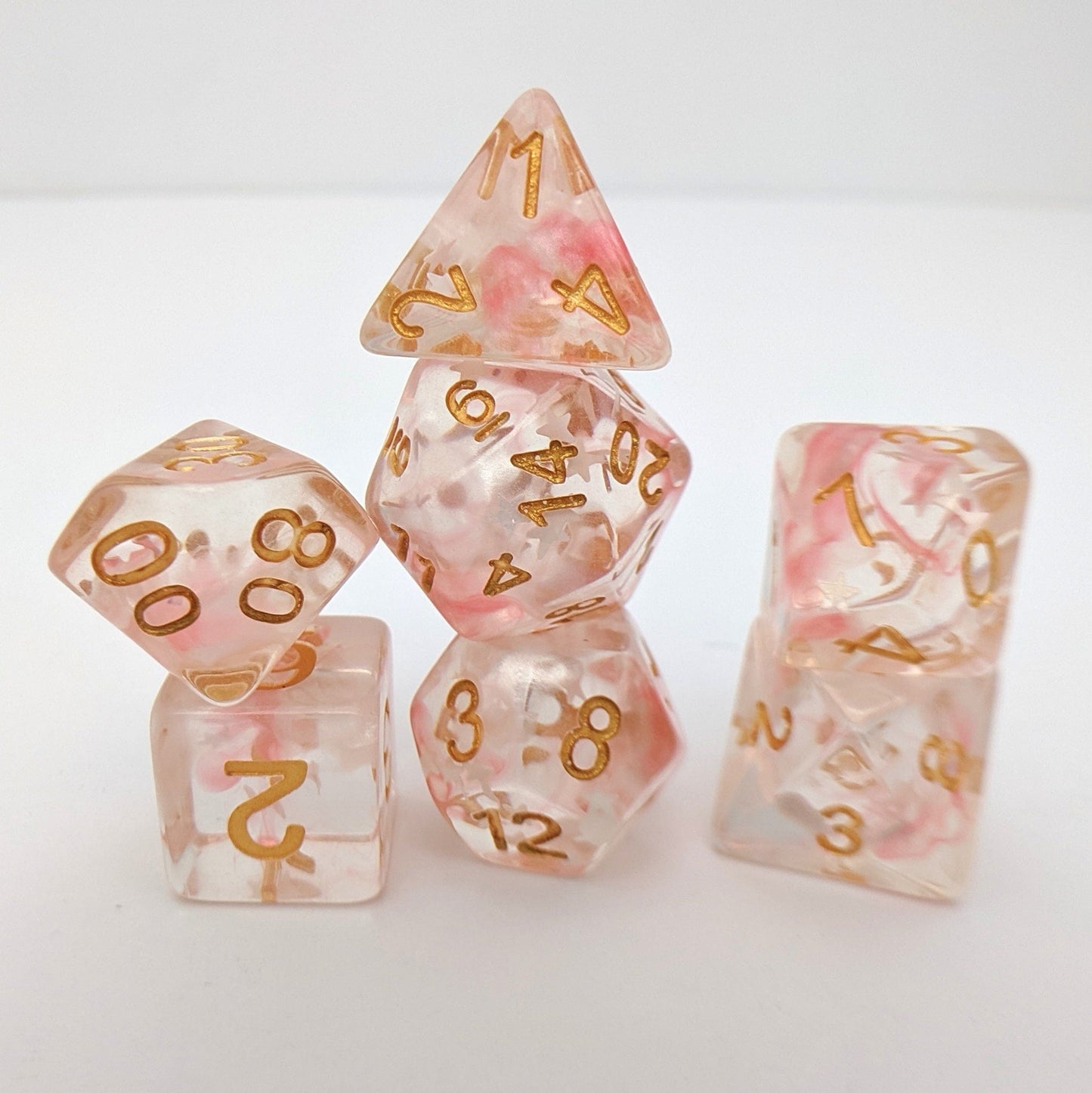 Harvest Moon Dice Set – 7-Piece Translucent Coral White Stars Gold Font DnD Dice sets Fennek and Finch