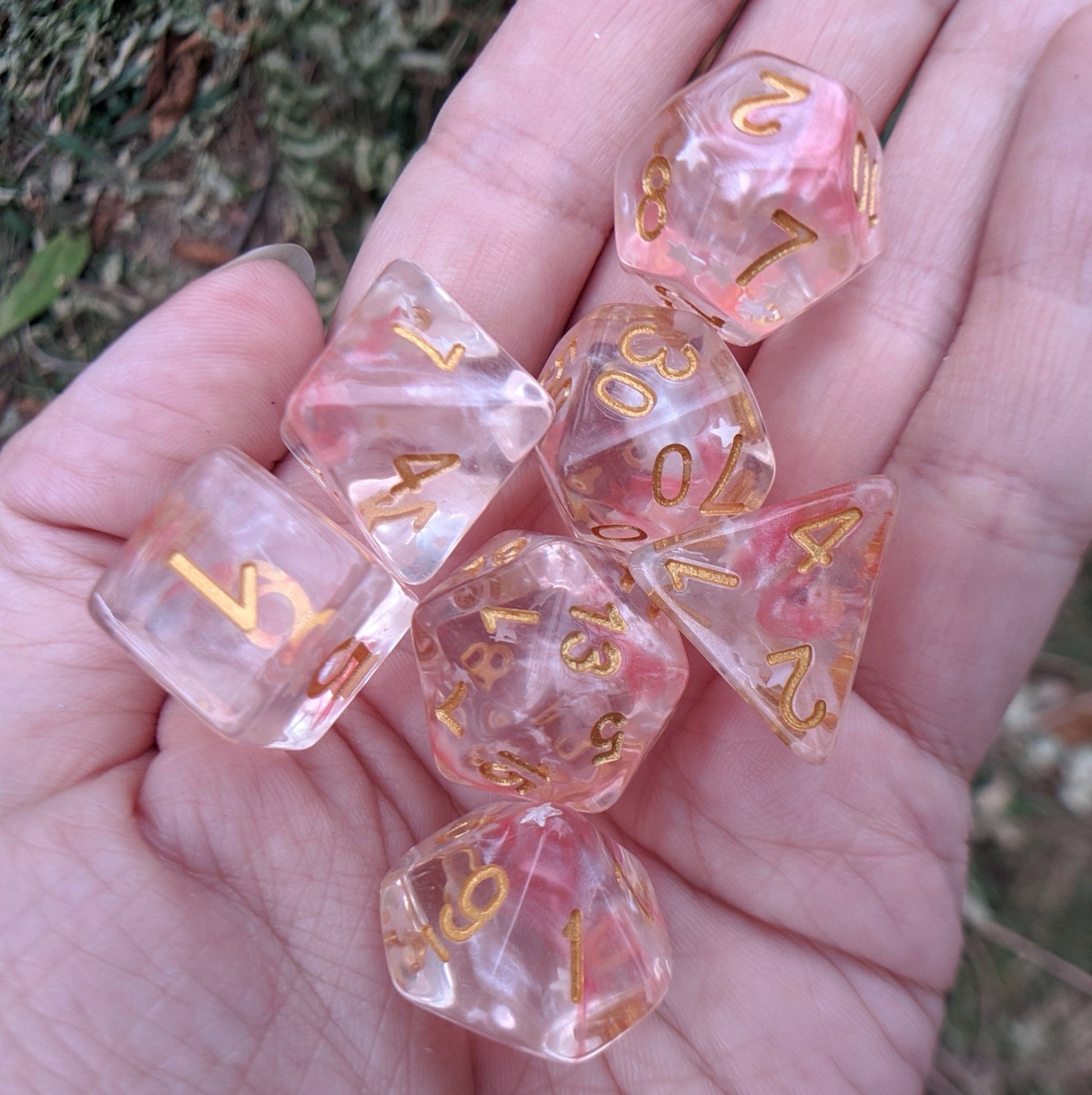 Harvest Moon Dice Set – 7-Piece Translucent Coral White Stars Gold Font DnD Dice sets Fennek and Finch