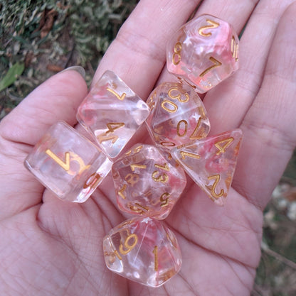 Harvest Moon Dice Set – 7-Piece Translucent Coral White Stars Gold Font DnD Dice sets Fennek and Finch