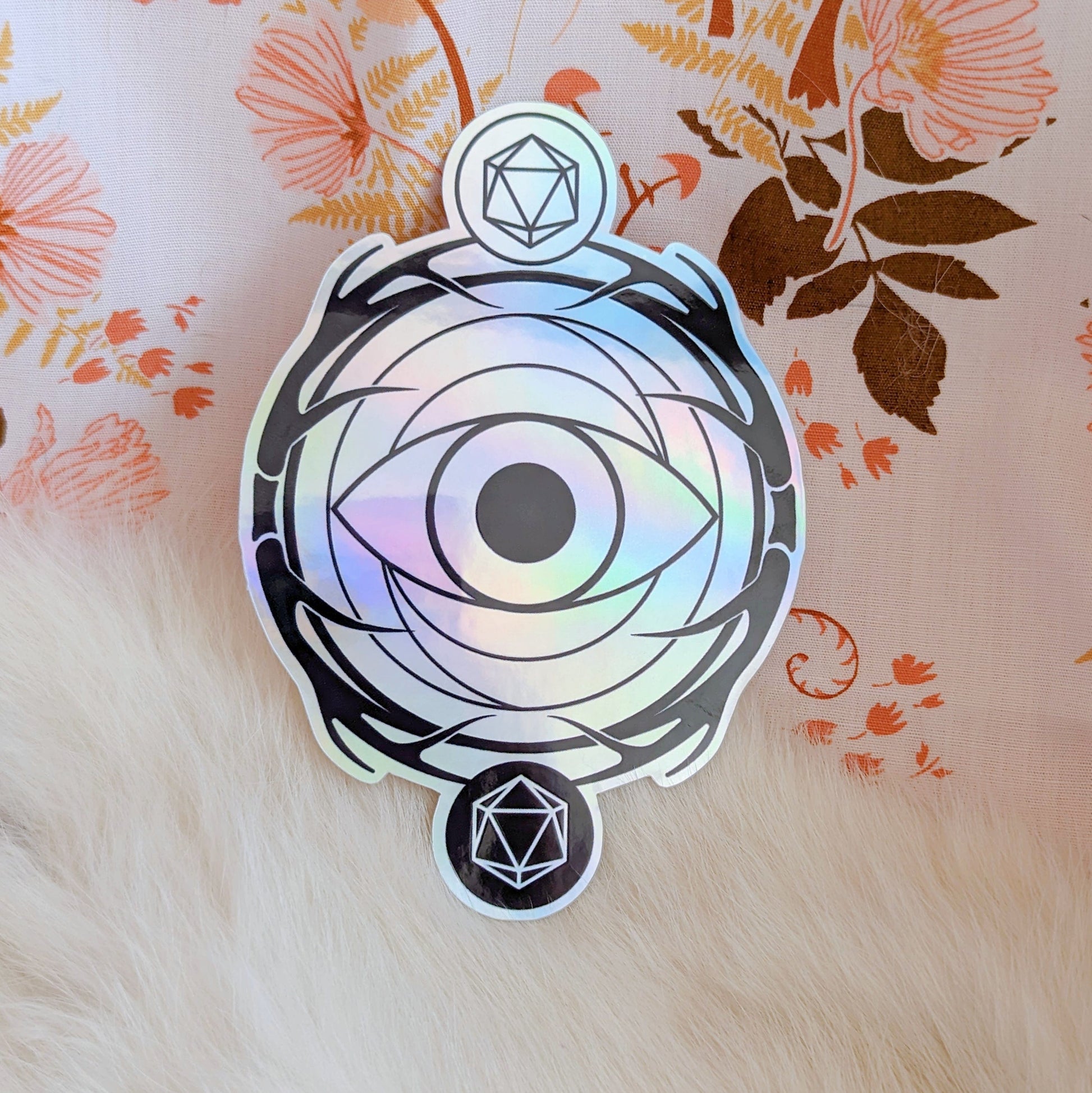 Holographic warlock sticker with mystical eye design on floral background, perfect for water bottles and laptops.