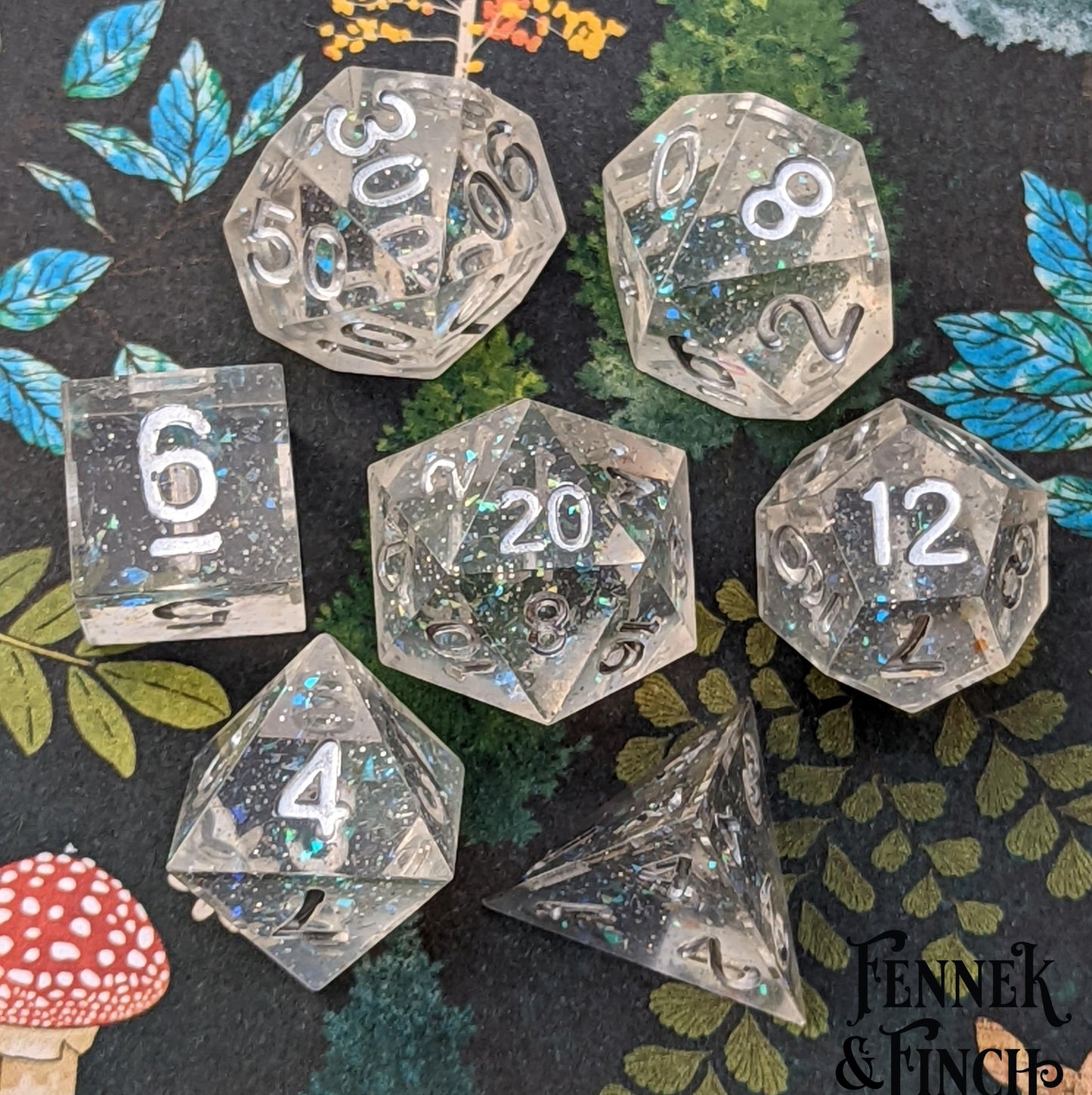 Ice Palace Sharp Edge Dice Set. Clear resin with tiny opal flakes and silver font.