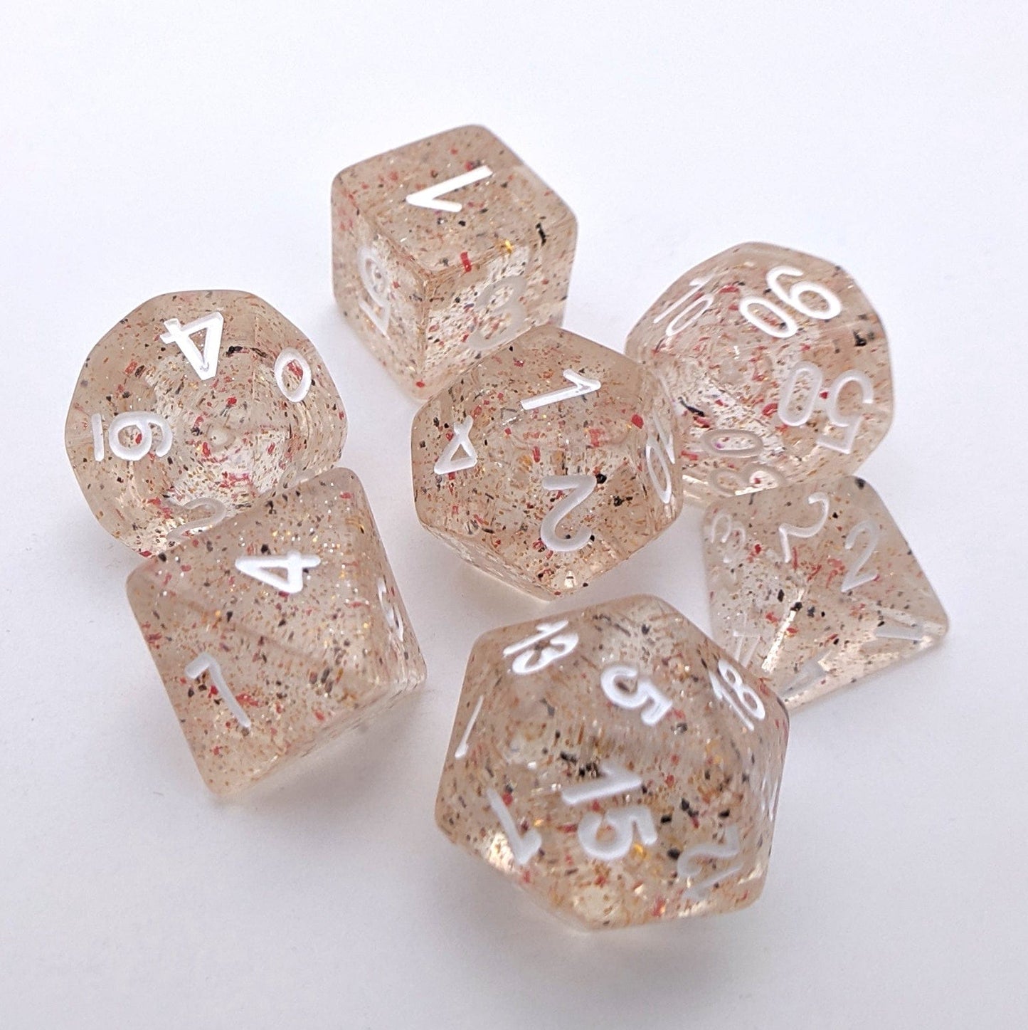 Little Stars Dice Set – 7-Piece Translucent Golden Glitter Red Black Particles Dice sets Fennek and Finch