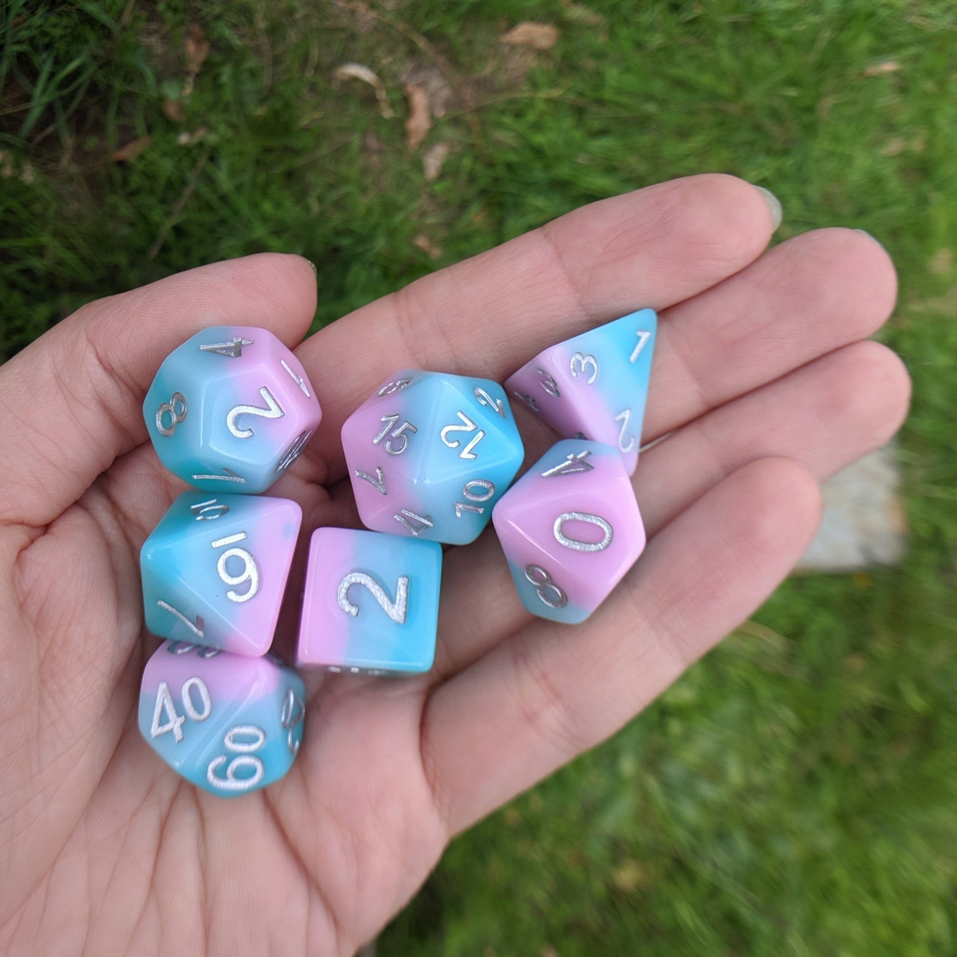 Pastel layered dice set in blue and lavender pink with silver numbers, Lover's Whisper Dice Set by HD, 7-piece RPG gaming dice.