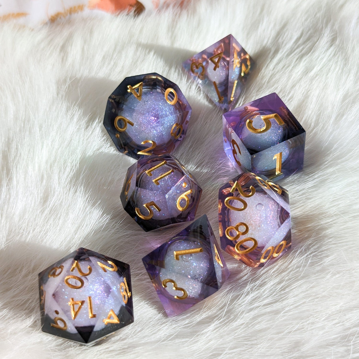 Night Castle Liquid Core Sharp Edge Resin DnD Dice Set with purple and black swirls on a soft white surface.
