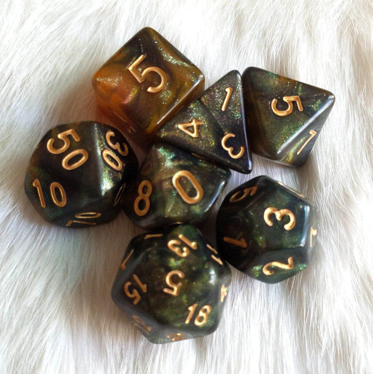 Nightingale Dice Set – 7-Piece Green Orange Gold Red Micro Shimmer Galaxy DnD Dice sets Fennek and Finch