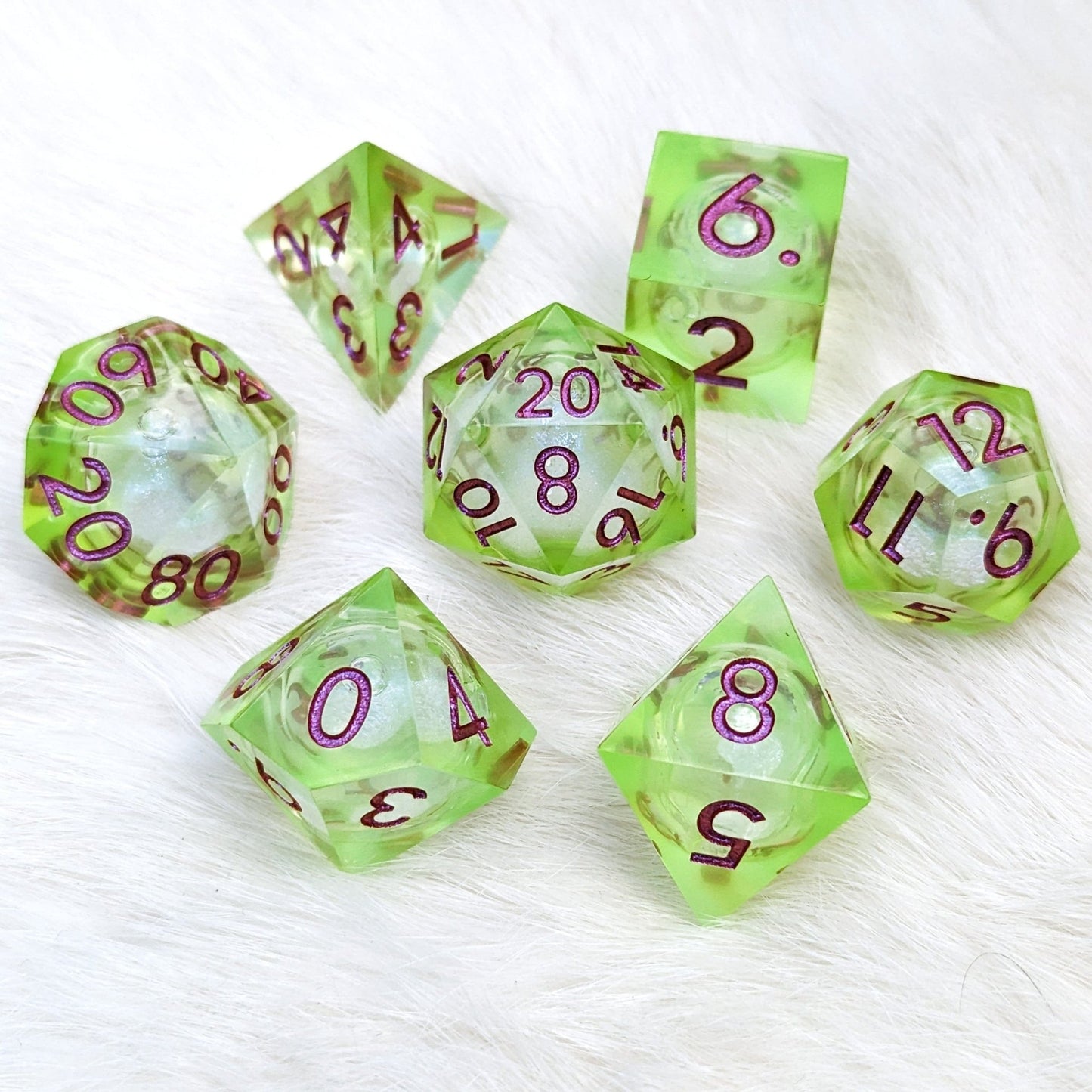 Ooze Liquid Core Sharp Edge Dice Set – 7 - Piece Bright Green Burgundy Font DnD - Fennek and Finch