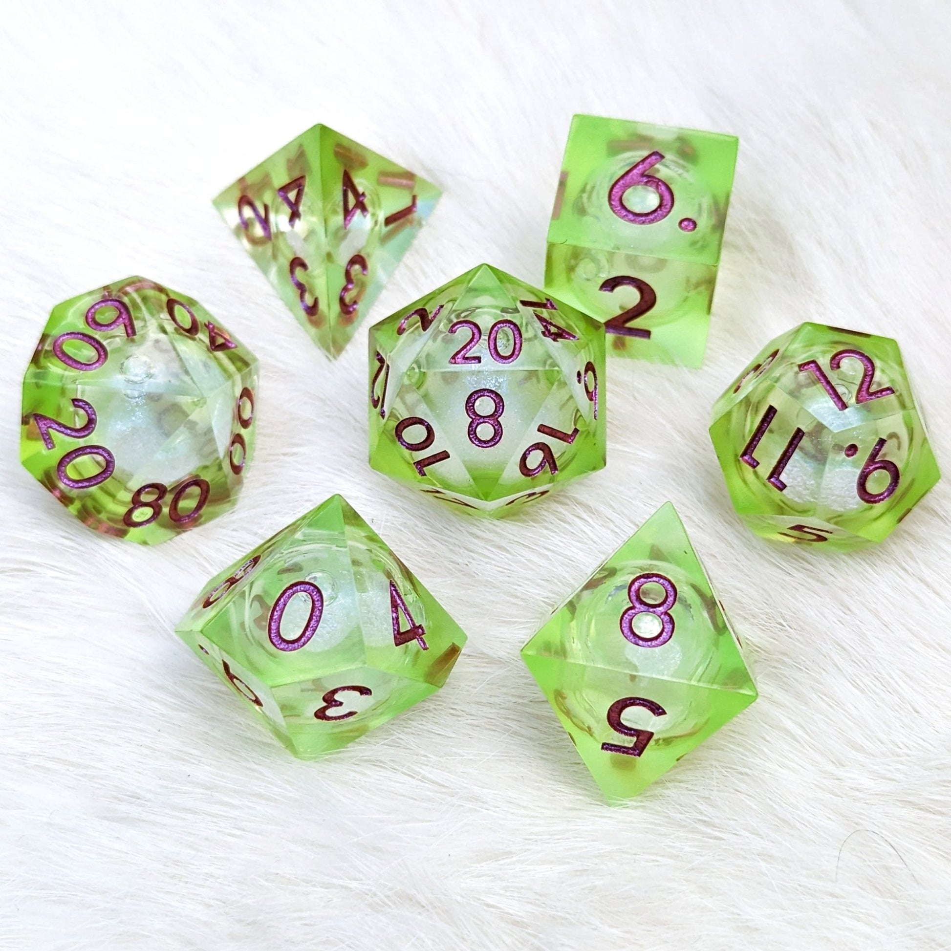 Ooze Liquid Core Sharp Edge Dice Set – 7 - Piece Bright Green Burgundy Font DnD - Fennek and Finch
