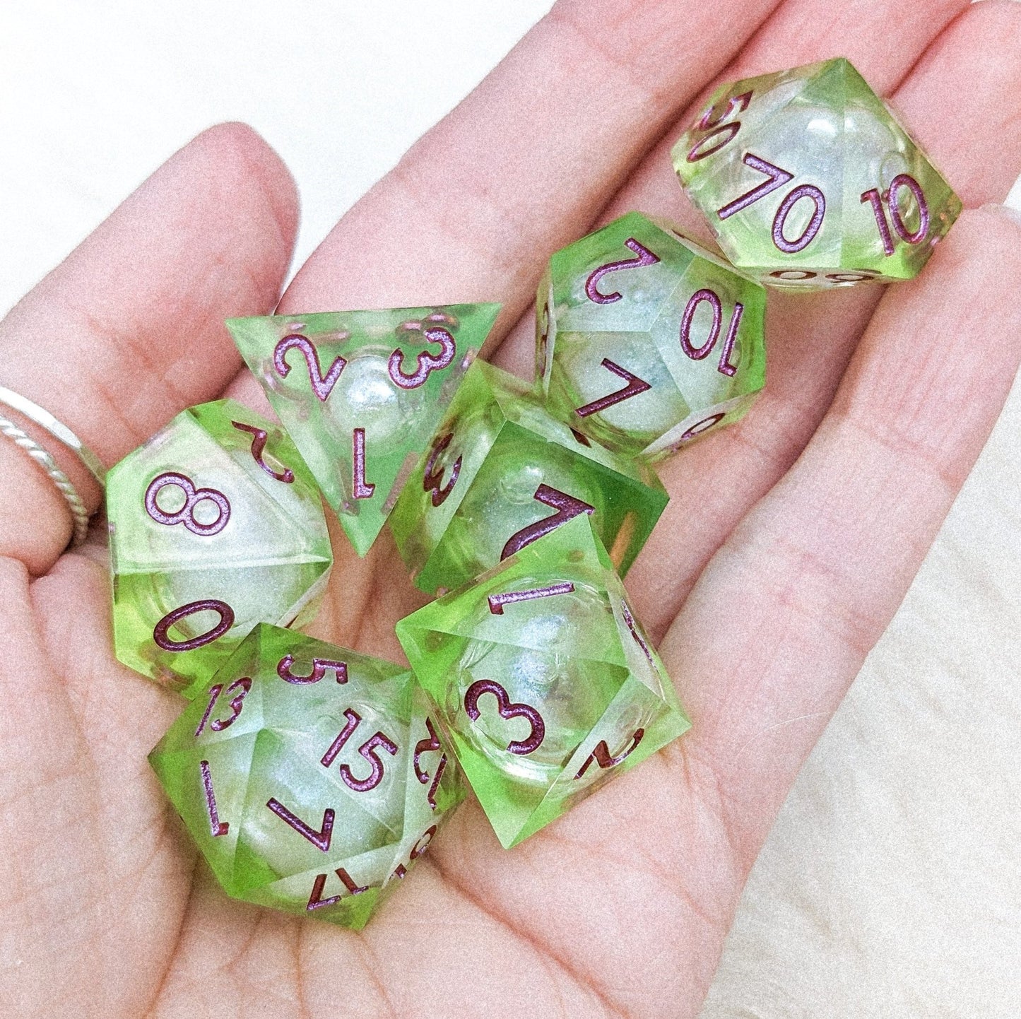 Ooze Liquid Core Sharp Edge Dice Set – 7 - Piece Bright Green Burgundy Font DnD - Fennek and Finch