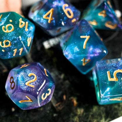 Shimmering purple and cyan Will O Wisp acrylic dice set, 7-piece polyhedral set for tabletop RPGs like Dungeons and Dragons.