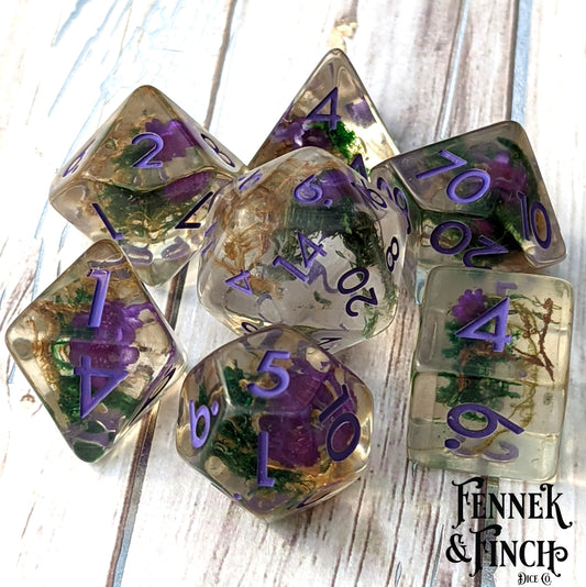 Purple Flower and Moss Dice Set, 7-piece terrarium polyhedral dice for Dungeons & Dragons, featuring real moss and flowers.