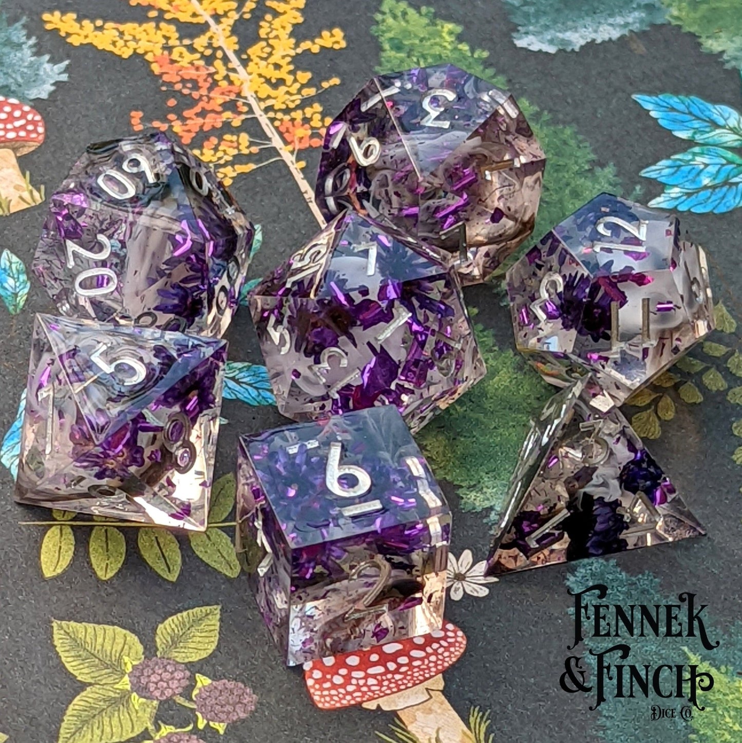 Purple Flower Dice Set – 7 - Piece Sharp Edge Clear Wispy Clouds DnD Dice - Fennek and Finch
