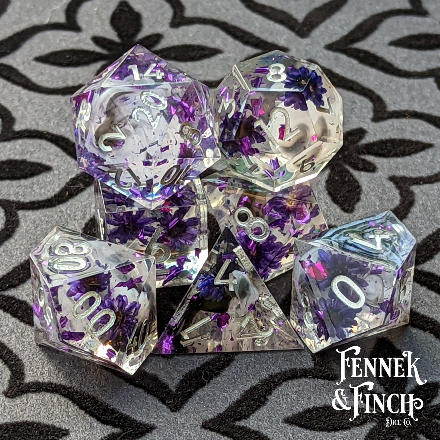 Purple Flower Dice Set – 7 - Piece Sharp Edge Clear Wispy Clouds DnD Dice - Fennek and Finch
