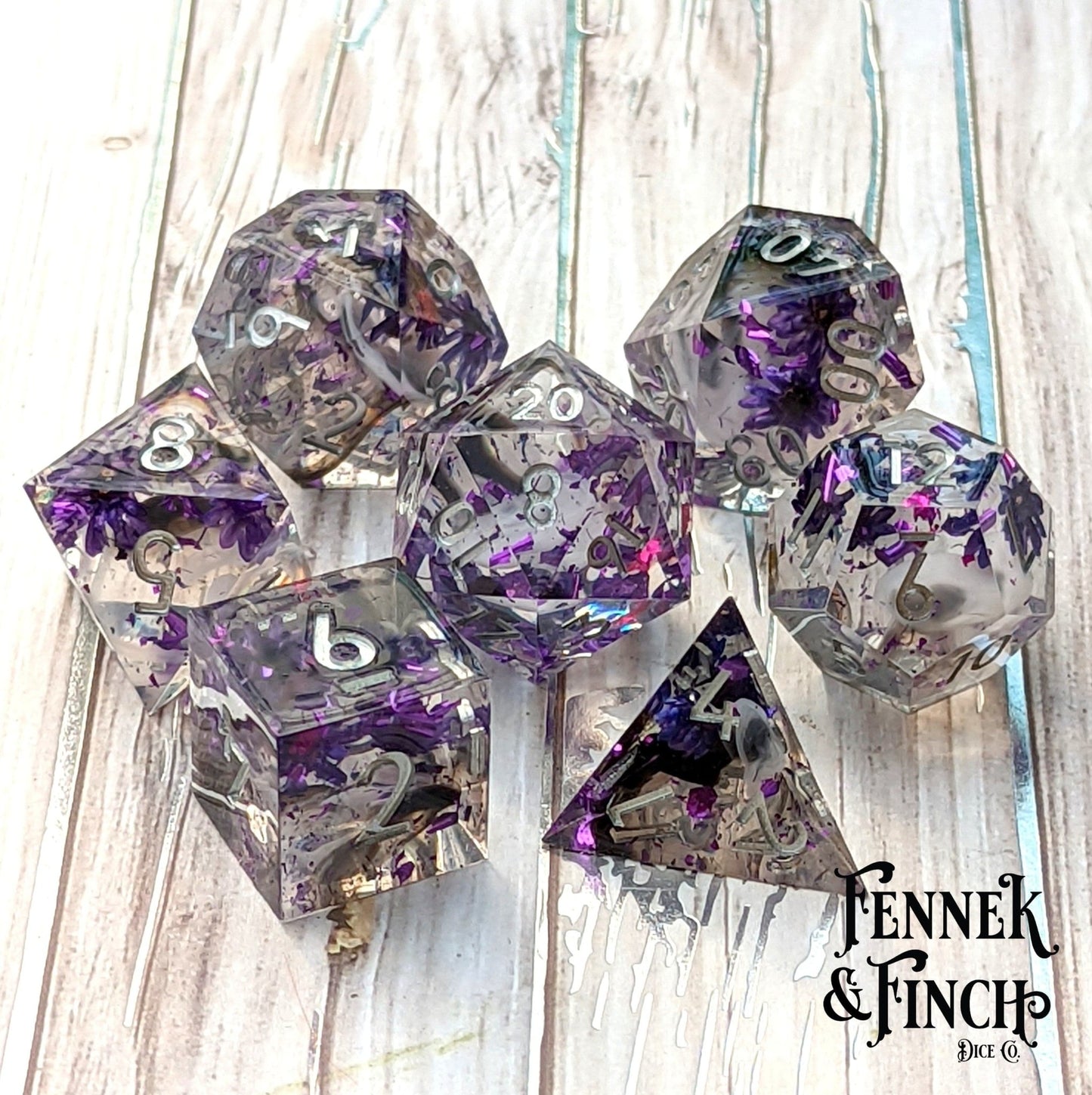 Purple Flower Dice Set – 7 - Piece Sharp Edge Clear Wispy Clouds DnD Dice - Fennek and Finch