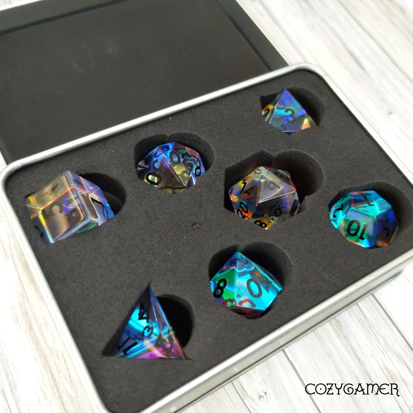 Iridescent Rainbow Prism Fractal Glass 7 Piece Dice Set in padded tin for Dungeons and Dragons tabletop games.