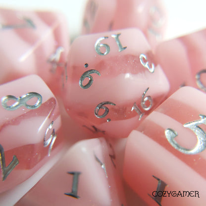 Pastel pink stripe polyhedral dice set "Rose Candies" by CozyGamer for Dungeons and Dragons and TTRPGs.