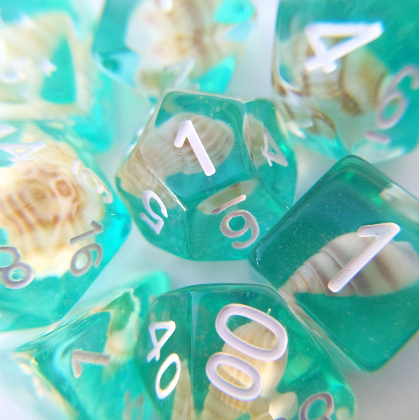 Sea Shell 8 Piece Dice Set. Real tiny sea shells sitting on a layer of teal glittering resin - CozyGamer