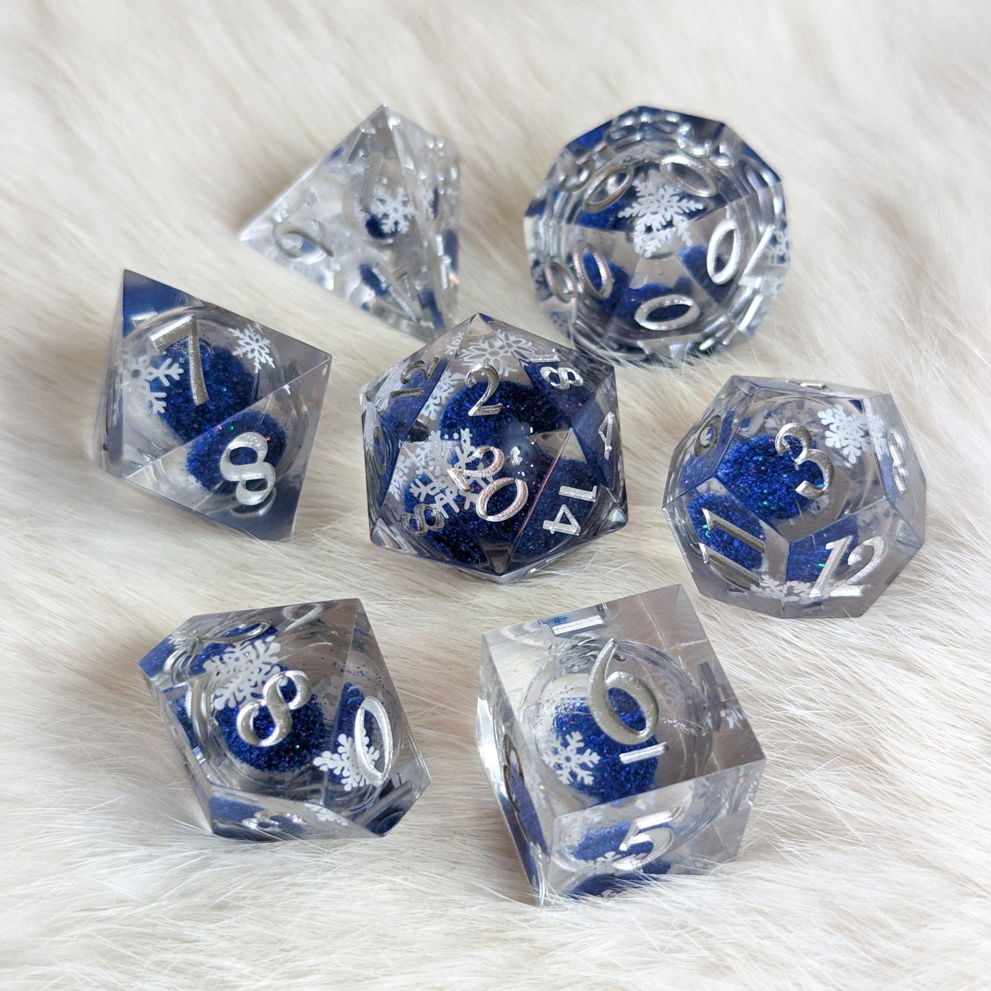 Snowflake Liquid Core Sharp Edge Dice Set – 7 - Piece Blue Glitter DnD Dice - Fennek and Finch