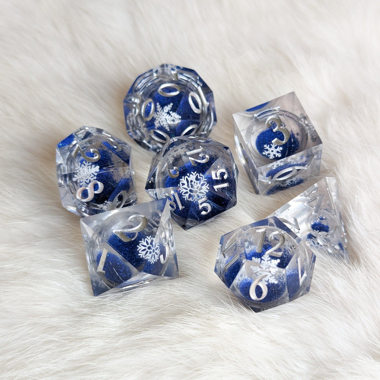 Snowflake Liquid Core Sharp Edge Dice Set – 7 - Piece Blue Glitter DnD Dice - Fennek and Finch