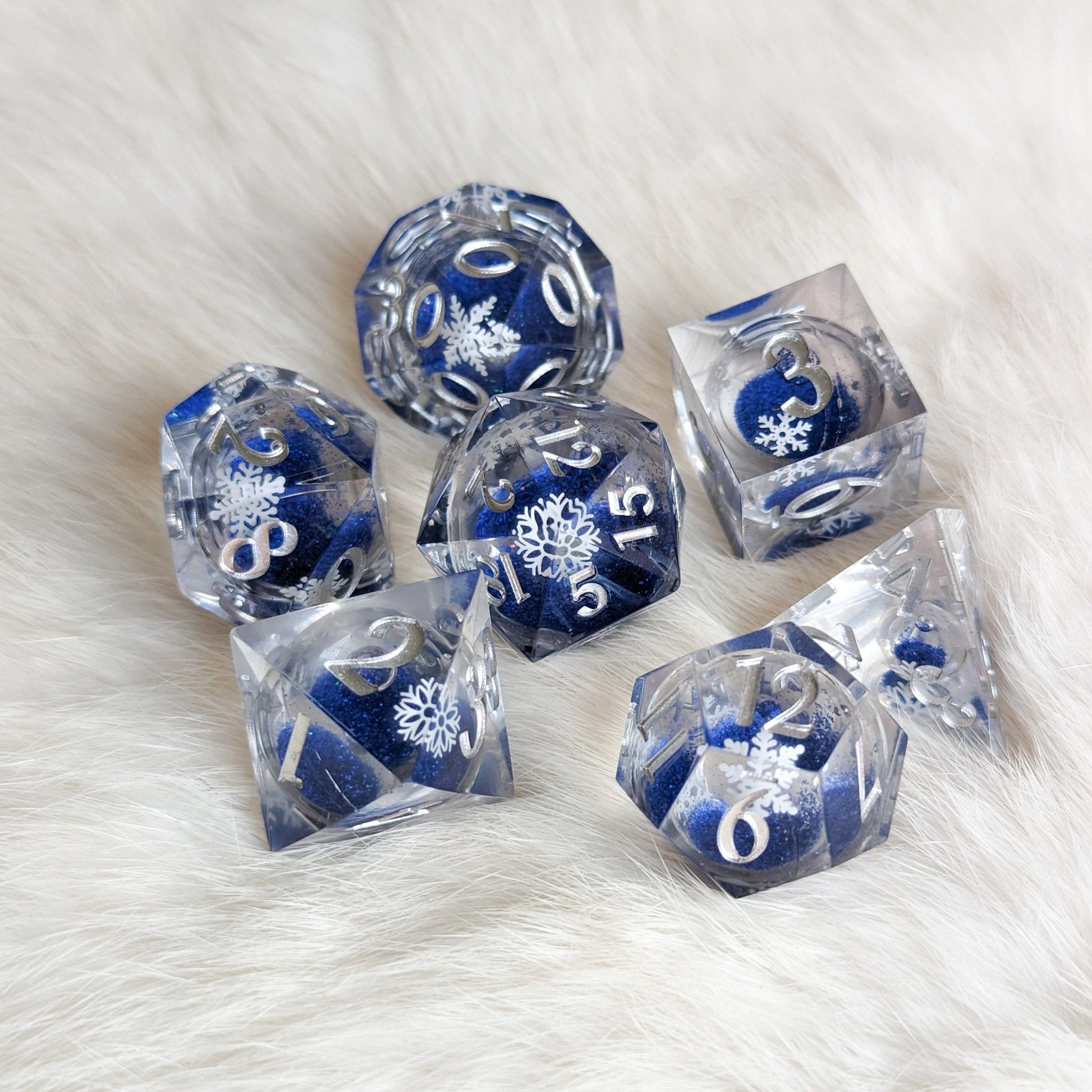 Snowflake Liquid Core Sharp Edge Dice Set – 7 - Piece Blue Glitter DnD Dice - Fennek and Finch