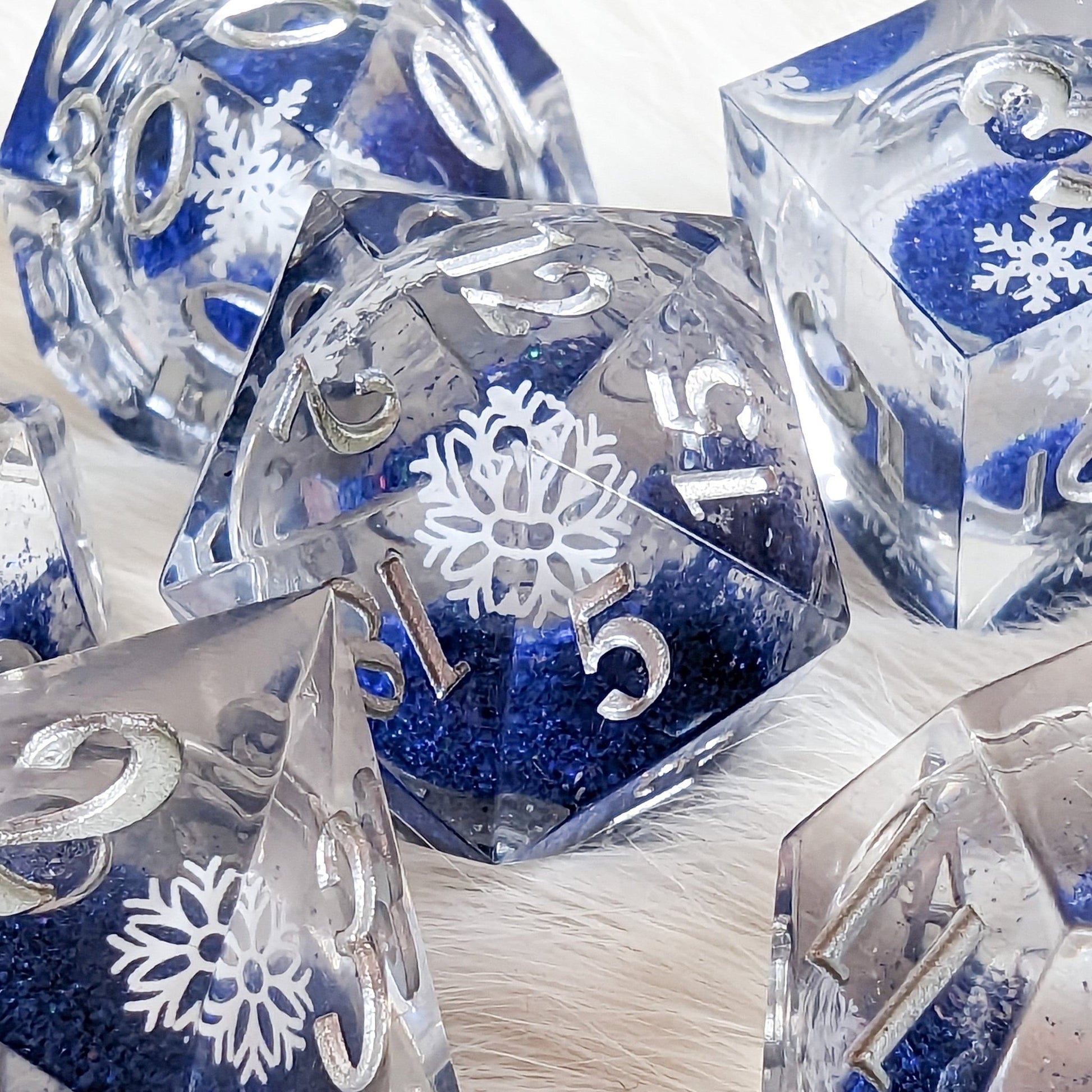 Snowflake Liquid Core Sharp Edge Dice Set – 7 - Piece Blue Glitter DnD Dice - Fennek and Finch
