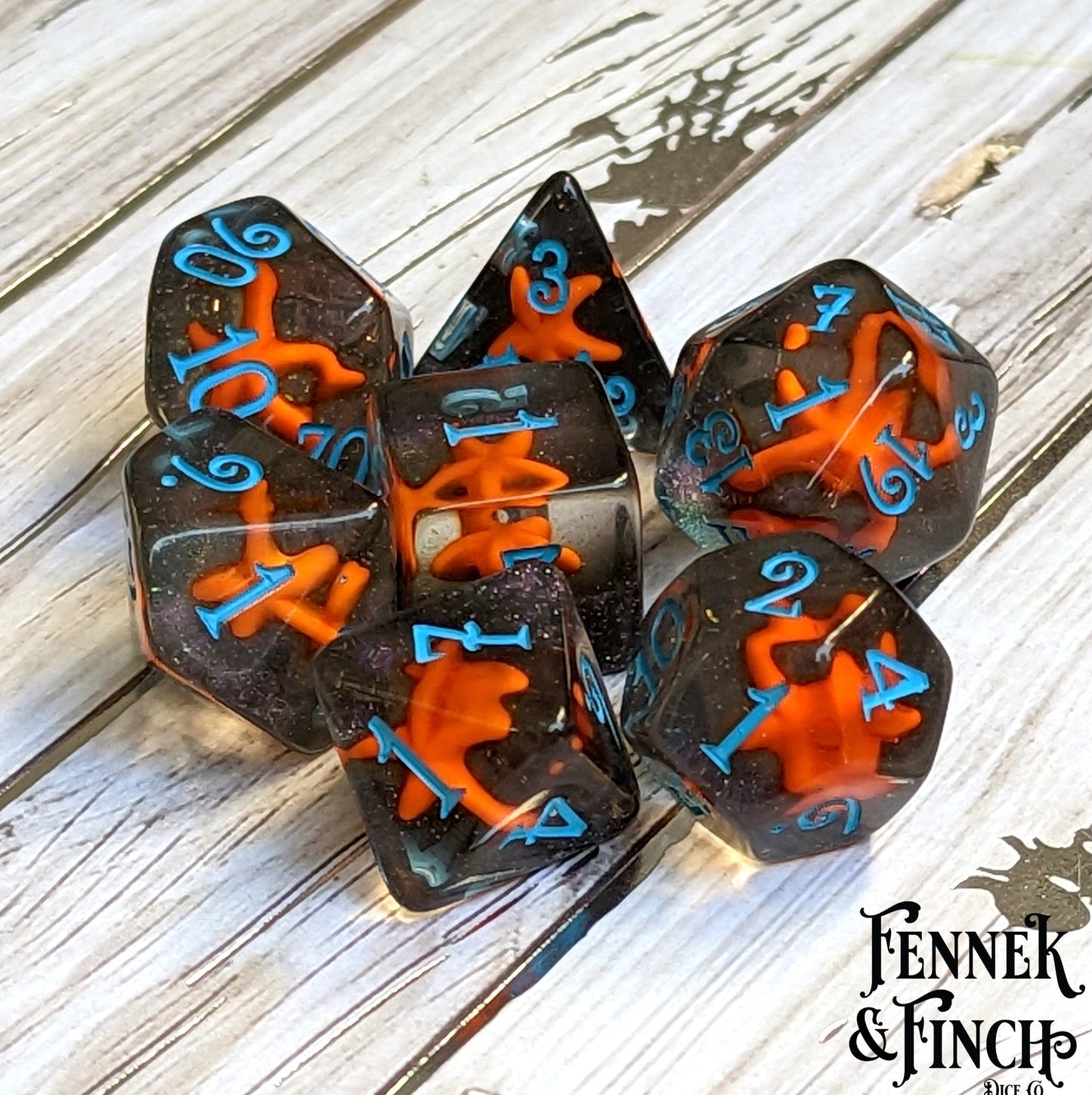 Starfish Dice Set - Bright Orange Starfish on Glittering Black Sand Polyhedral Dice for DND and TTRPGs by CozyGamer