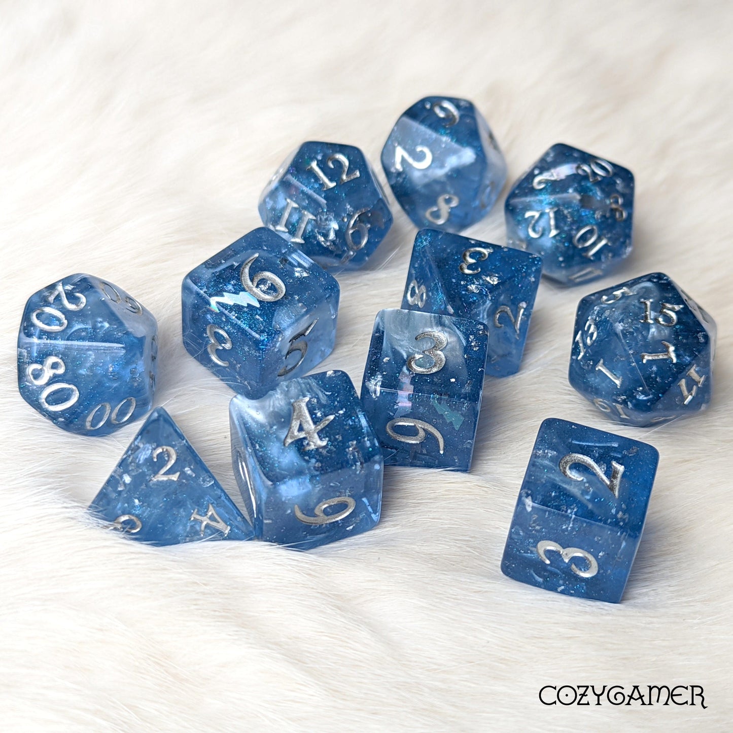 Storm Daddy Dice Set. Dark blue with white clouds and lightning. 11 Piece, 7 Piece, D10, and D6 Sets 11 Piece Set