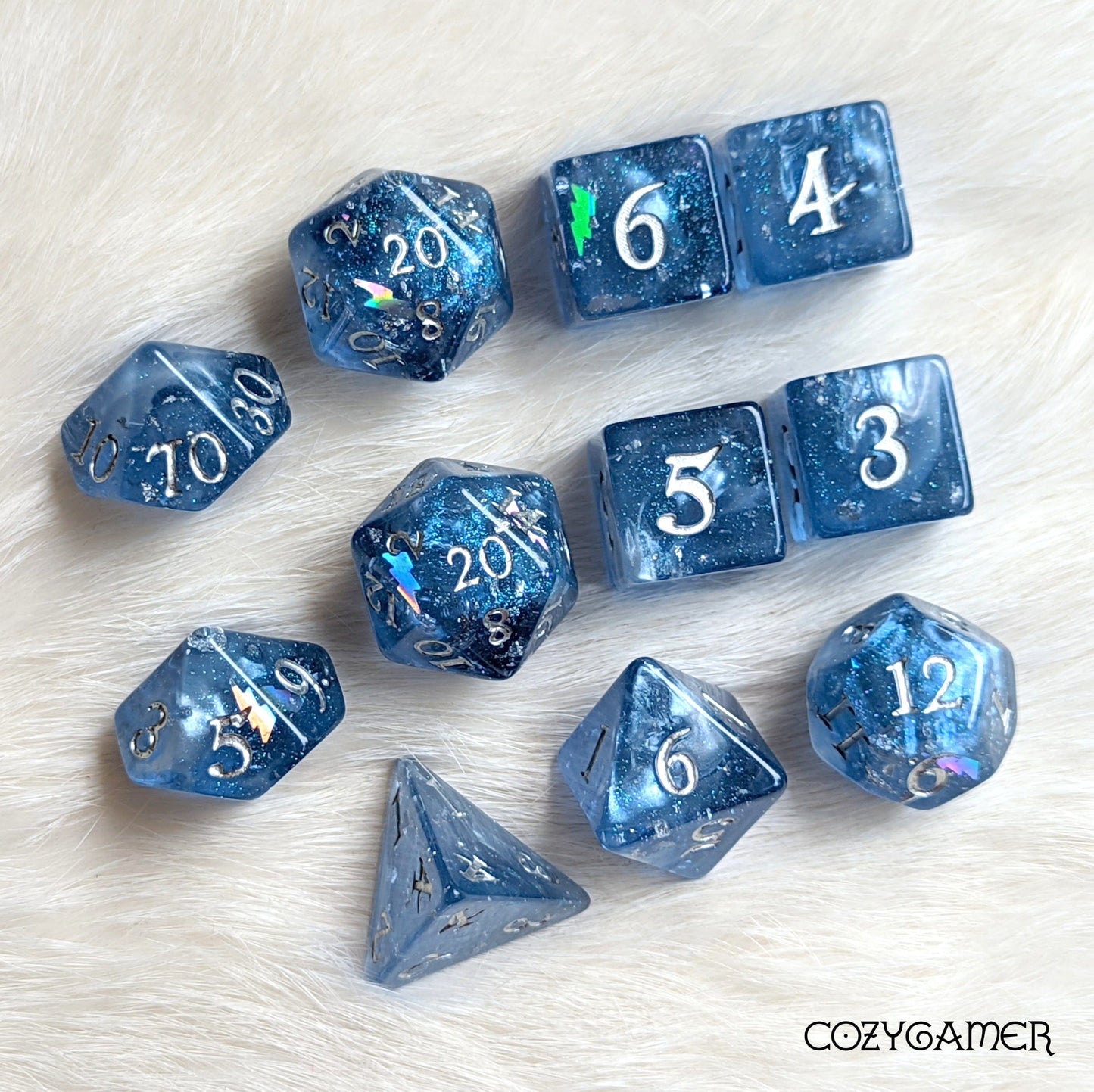 Storm Daddy Dice Set. Dark blue with white clouds and lightning. 11 Piece, 7 Piece, D10, and D6 Sets