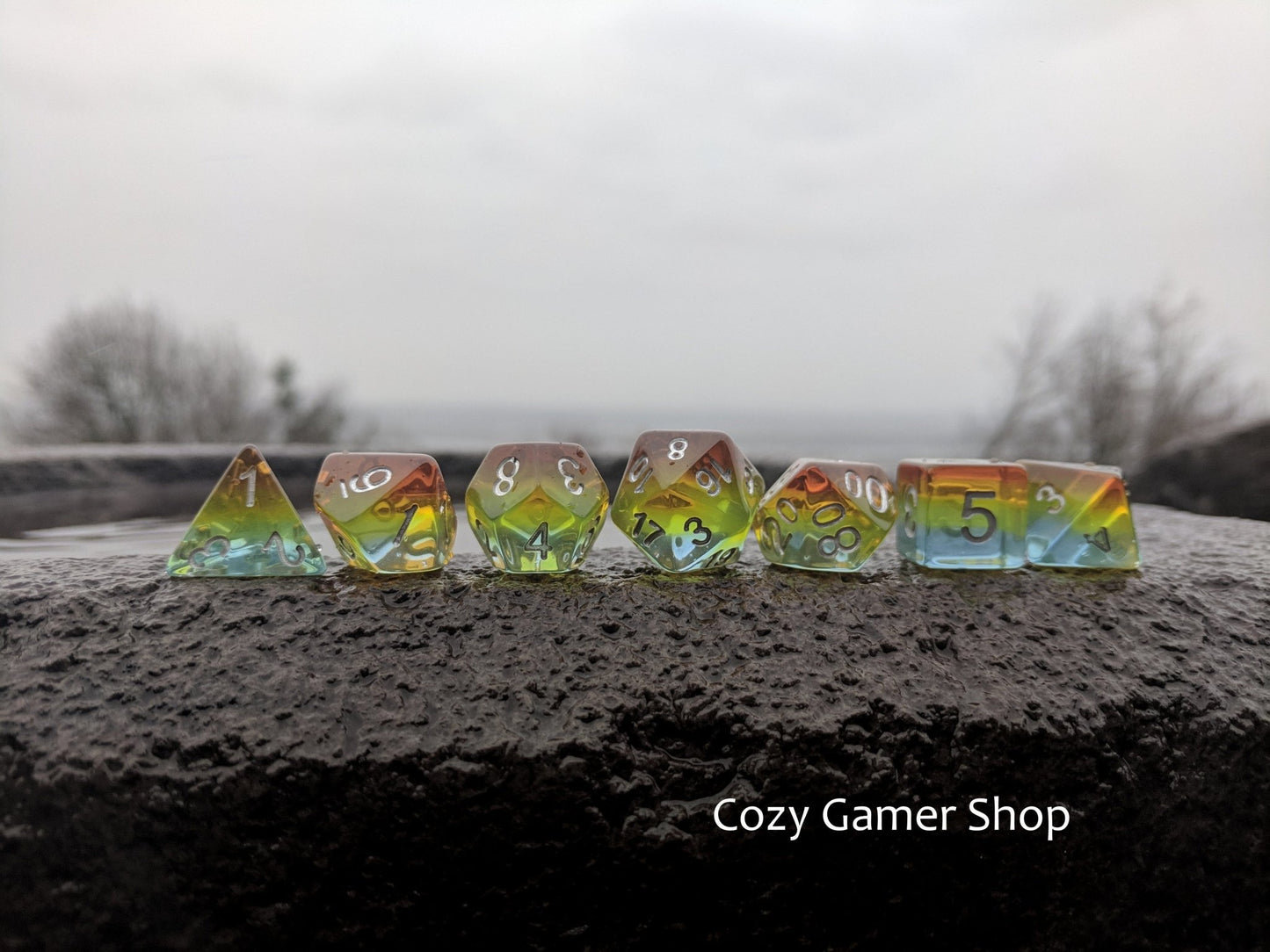Sunrise Dice Set – Layered Blue, Green, Yellow & Orange with Silver Numbers - Fennek and Finch