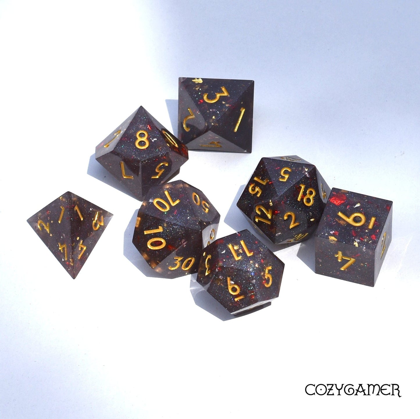 Volcanic Ash Sharp Edge Dice Set. Grey shimmering glitter and red flakes