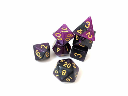 Black and purple 7-piece polyhedral dice set with glitter for Dungeons and Dragons games.