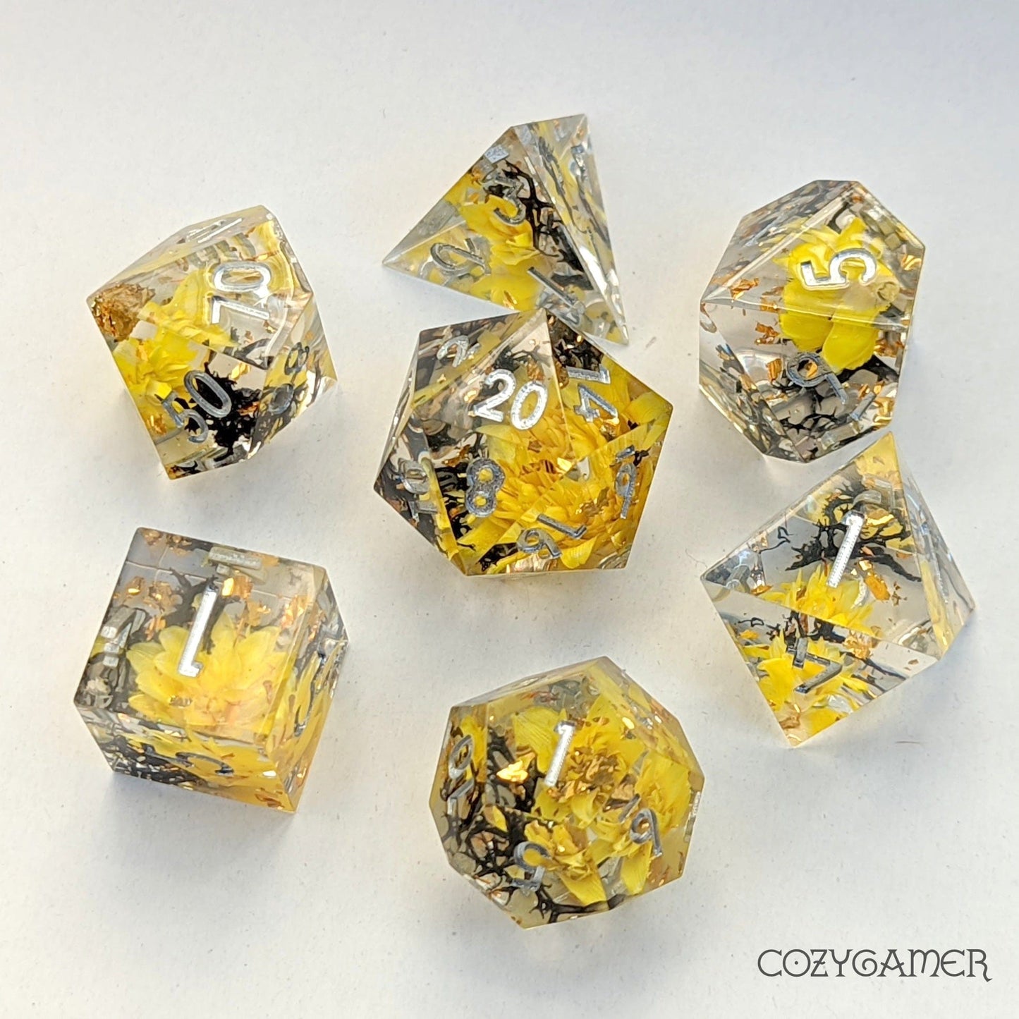 Yellow Flowers and Black Moss Sharp Edge Resin Dice Set. 7 Piece DND dice set with real dried flowers.